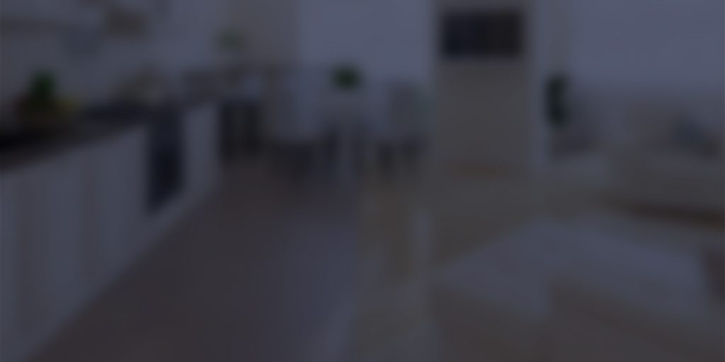 An image of a kitchen and living room blurry