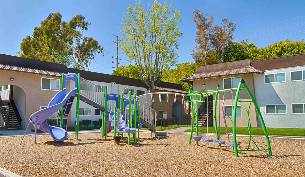 Playground surrounded by apartment complex