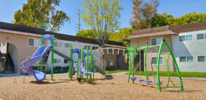 Playground surrounded by apartment complex